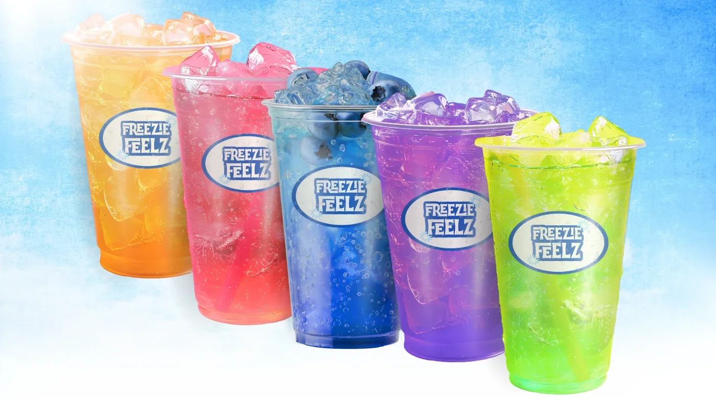 Five FreezieFeelz cups lined up: orange, strawberry, blueberry, grape and green apple